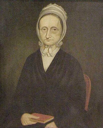 Portrait of a seated woman holding a book wearing a bonnet and black dress.